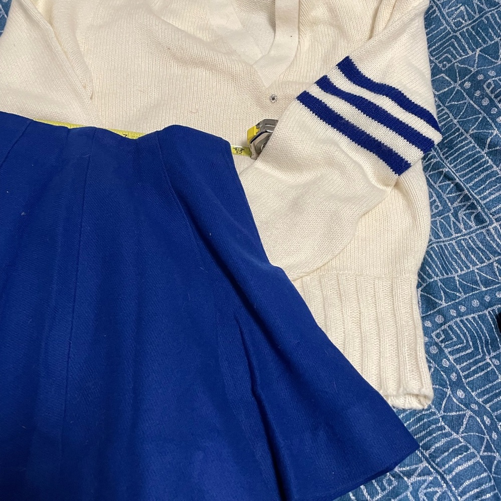Cheerleader sweater and pleated skirt